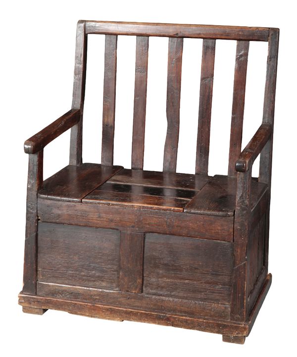 A PROVINCIAL STAINED PINE ARMCHAIR