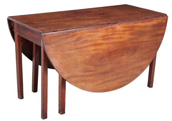 A GEORGE III MAHOGANY DROP-FLAP DINING TABLE