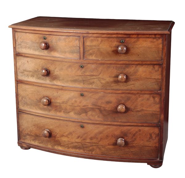 A BOW FRONT MAHOGANY CHEST OF DRAWERS