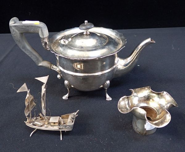 A SILVER TEAPOT