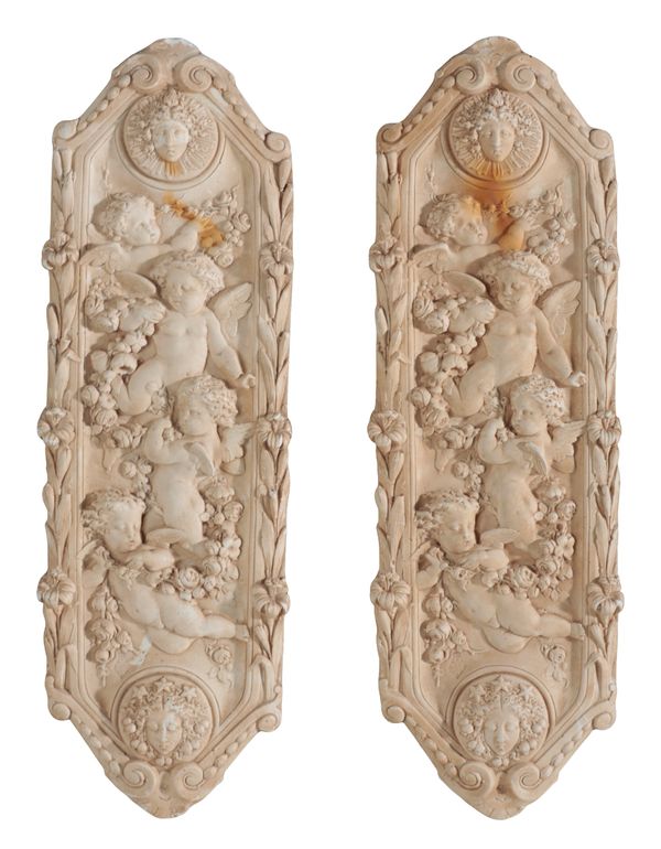 A PAIR OF PLASTER RELIEF CARVED WALL PLAQUES