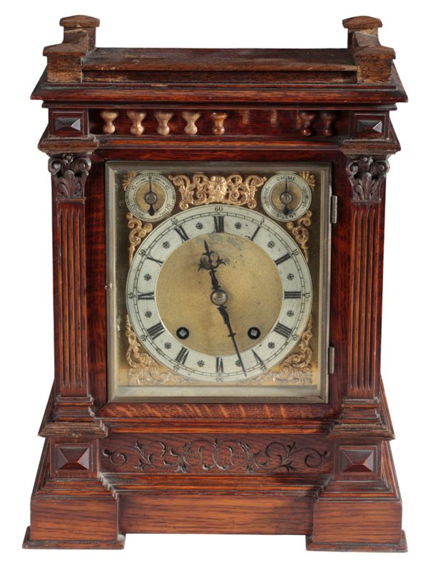 A VICTORIAN OAK MANTEL CLOCK