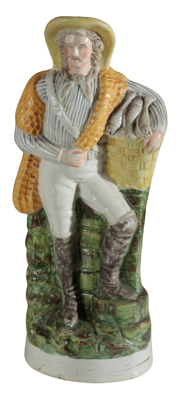 A VICTORIAN STAFFORDSHIRE POTTERY FIGURE OF A FISHERMAN