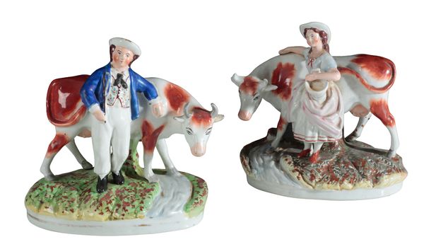 A PAIR OF VICTORIAN STAFFORDSHIRE POTTERY FIGURES, MILK MAID AND COW HERD