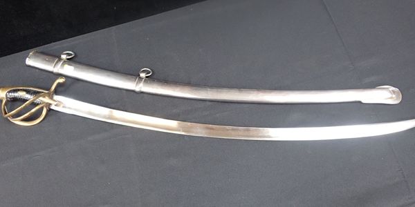 A CAVALRY SWORD, IN POLISHED STEEL SCABBARD