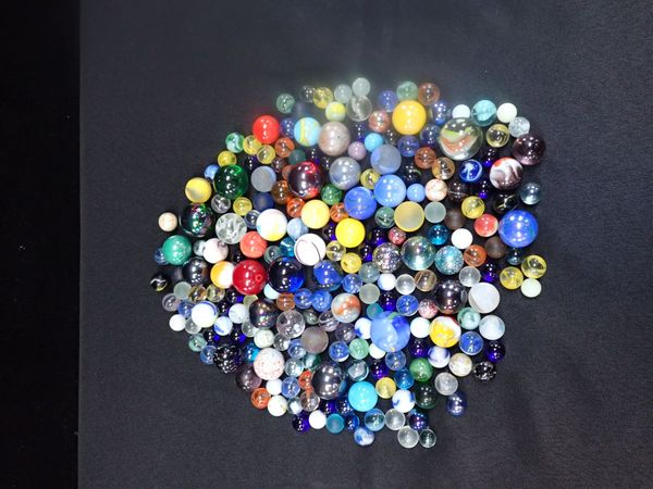 A COLLECTION OF GLASS MARBLES