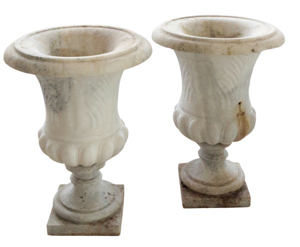 A PAIR OF MARBLE URNS