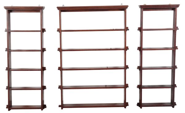 A GROUP OF THREE STAINED WOOD WALL SHELVES