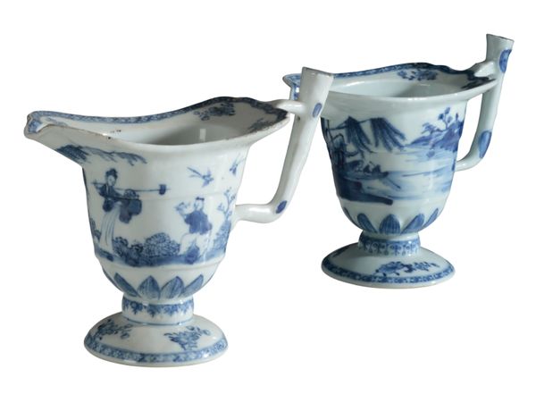 TWO CHINESE EXPORT PORCELAIN HELMET SHAPED JUGS