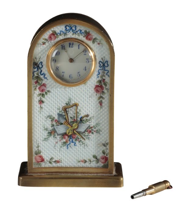 AN EARLY 20TH CENTURY ENAMELLED BRASS ‘WINDSOR’ TIMEPIECE