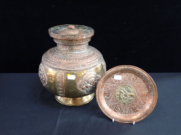 AN INDIAN BRASS AND COPPER VESSEL WITH COVER