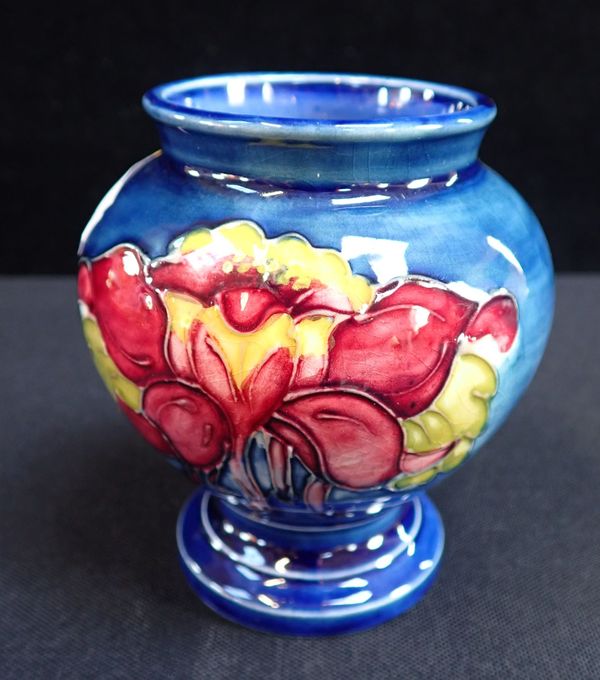 MOORCROFT: AN ORCHID DECORATED SQUAT VASE