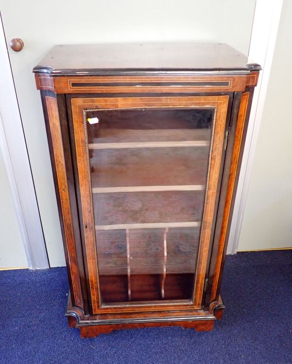 A VICTORIAN BURR WALNUT AND EBONISED MUSIC CABINET
