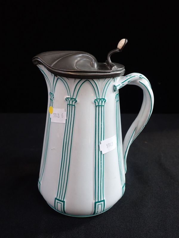 A VICTORIAN RELIEF MOULDED JUG, WITH  PEWTER LID