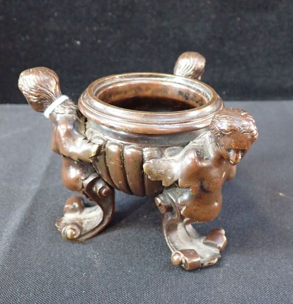 A BAROQUE STYLE BRONZE CENSER, SUPPORTED BY PUTTI