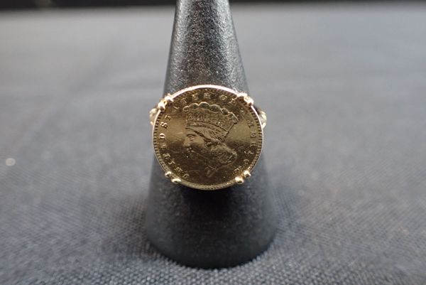 AN 1862 DOLLAR, MOUNTED AS A RING