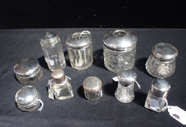 TEN PLAIN SILVER-TOPPED DRESSING JARS