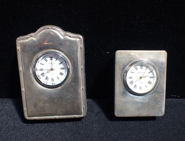 TWO SILVER CASED CLOCKS