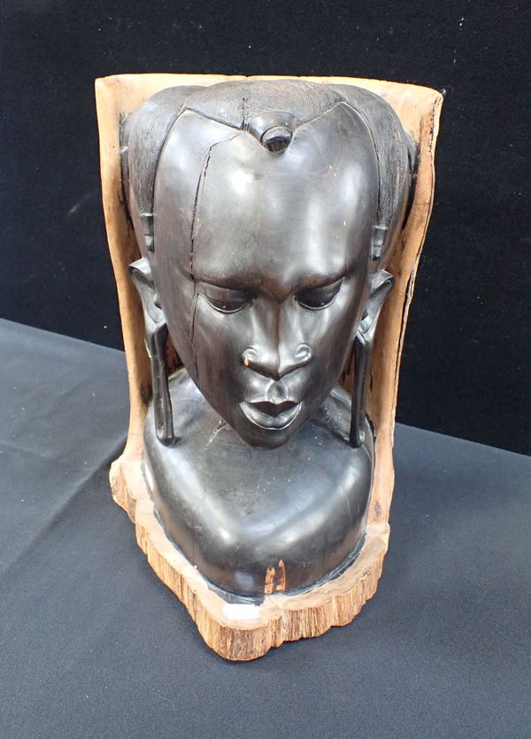 AN AFRICAN CARVED WOODEN HEAD