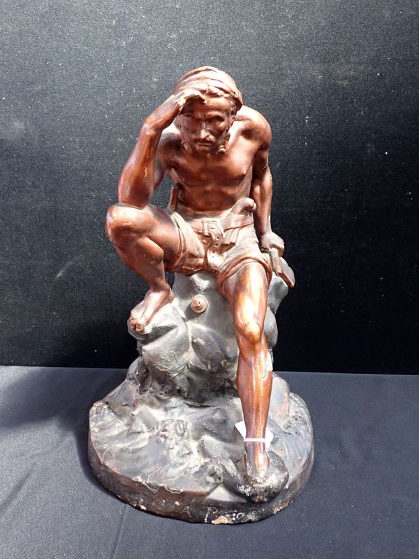 AN EARLY 20TH CENTURY BRONZED PLASTER FIGURE