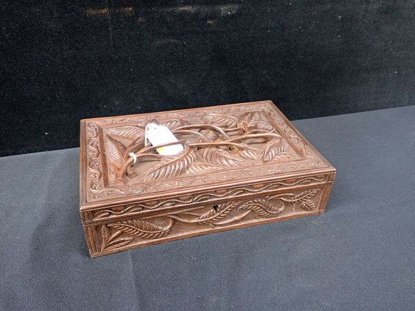 AN INDIAN CARVED HARDWOOD CIGAR BOX