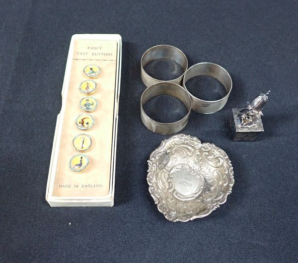 THREE SILVER NAPKIN RINGS, A SILVER DISH