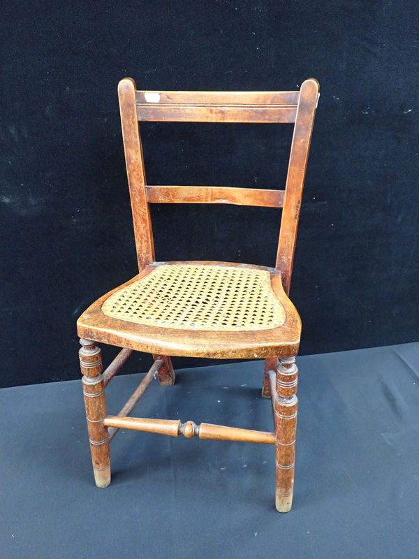 A CHILD'S CANE SEATED CHAIR