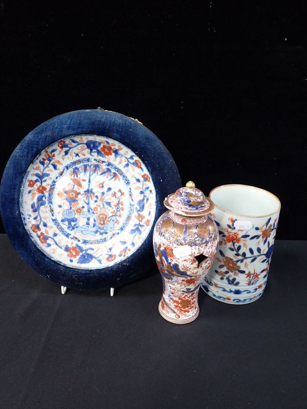 AN IMARI DISH SET IN A CIRCULAR FRAME