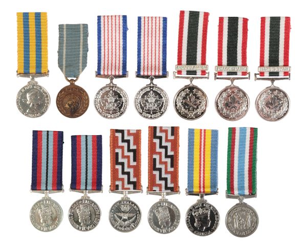 CANADA AND NEW ZEALAND. A COLLECTION OF MINIATURE MEDALS