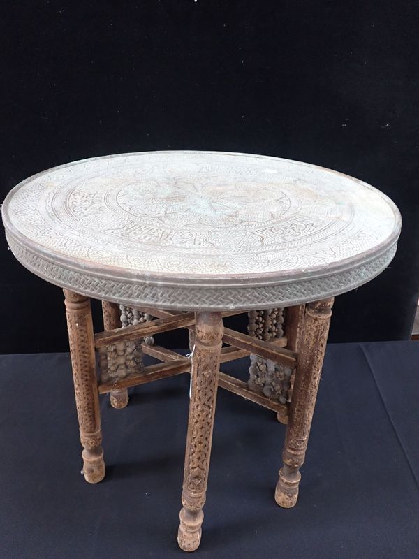 A PERSIAN BRASS-TOPPED TABLE