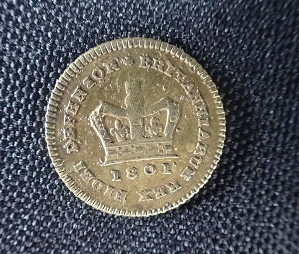 A COUNTERFEIT THIRD GUINEA, OR SEVEN SHILLING PIECE