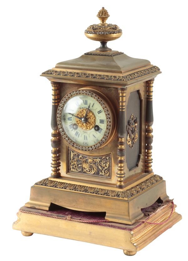 A 19TH CENTURY FRENCH BRASS MANTLE CLOCK BY VINCENZI ET CIE