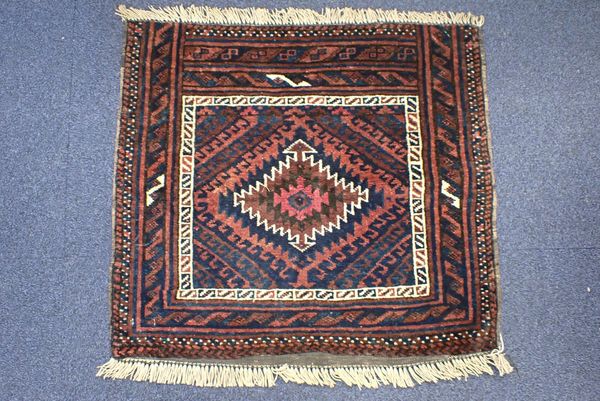 A SMALL IRANIAN BALOUCH RUG, OF TRADITIONAL DESIGN