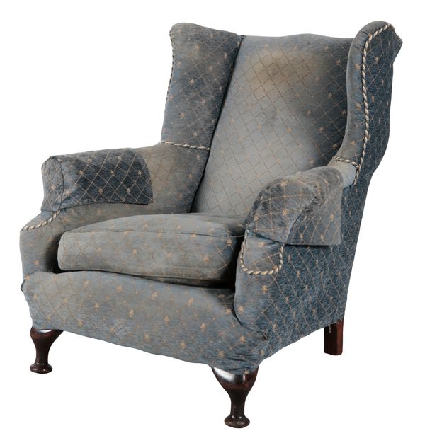 A WING BACK ARMCHAIR