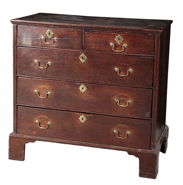 A PROVINCIAL GEORGE III OAK CHEST OF DRAWERS