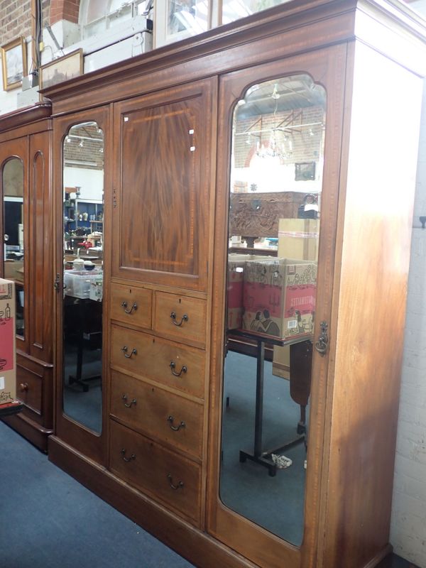 AN EDWARDIAN MAHOGANY TRIPLE WARDROBE