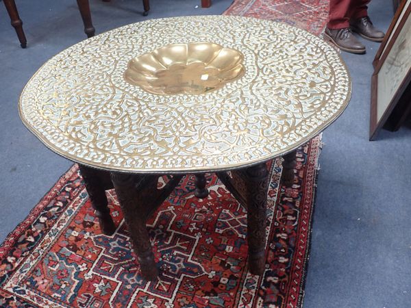 AN INDIAN BRASS-TOPPED TABLE