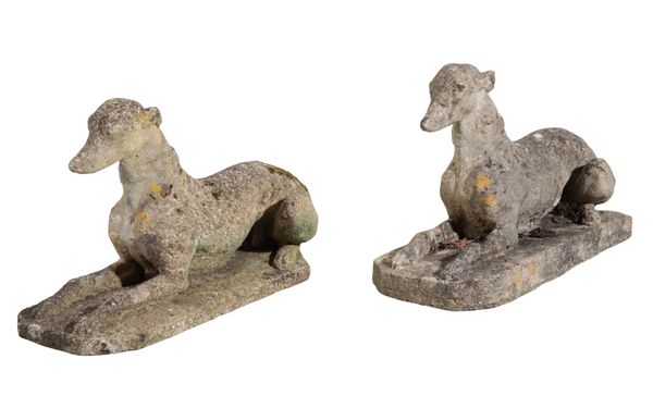 A PAIR OF RECONSTITUTED  STONE GREYHOUNDS