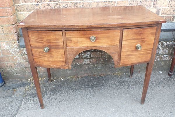 A GEORGE III BOW FRONT DRESSING TABLE