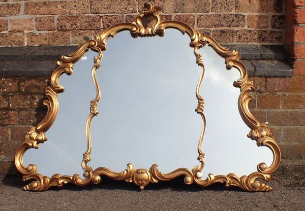 A GILT FRAMED ROCOCO STYLE MIRROR