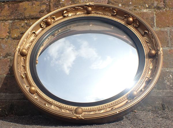 A REGENCY STYLE CONVEX MIRROR