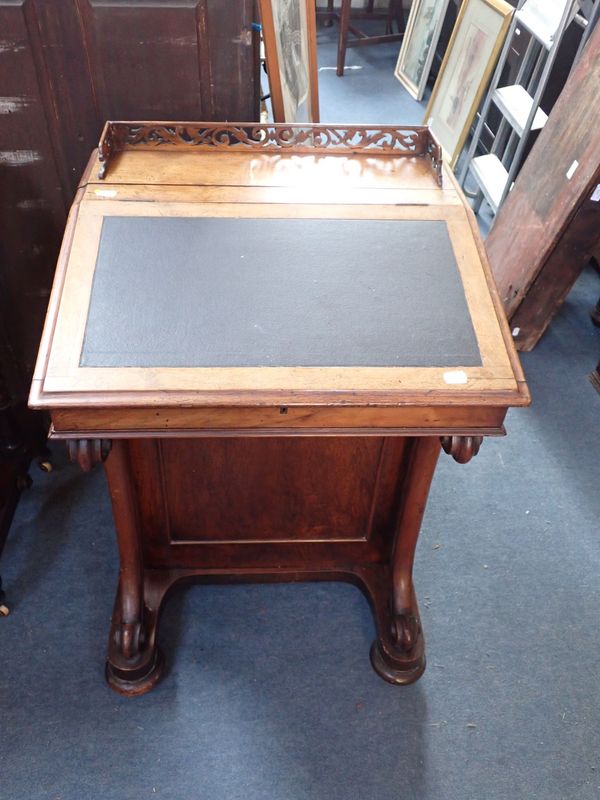 A VICTORIAN WALNUT DAVENPORT