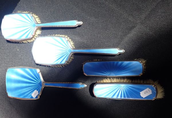 A SILVER AND ENAMEL DRESSING TABLE BRUSH SET