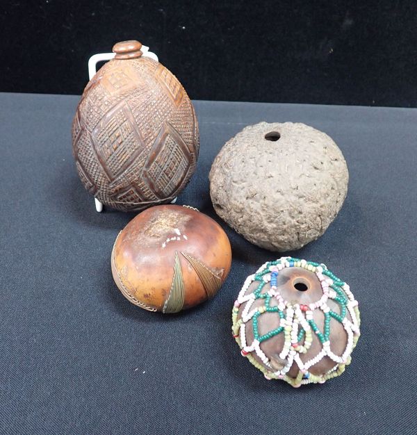 A CARVED COCONUT SHELL