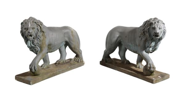 AFTER THE ANTIQUE: A PAIR OF PAINTED STONE MEDICI LIONS