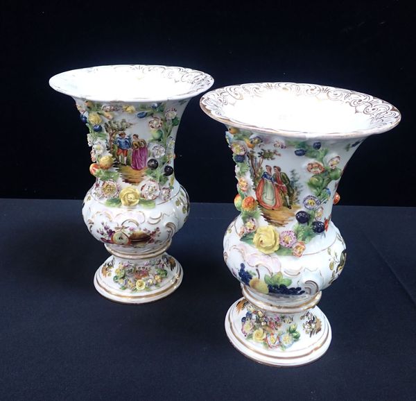 A PAIR OF MEISSEN STYLE PAINTED AND FLOWER ENCRUSTED VASES