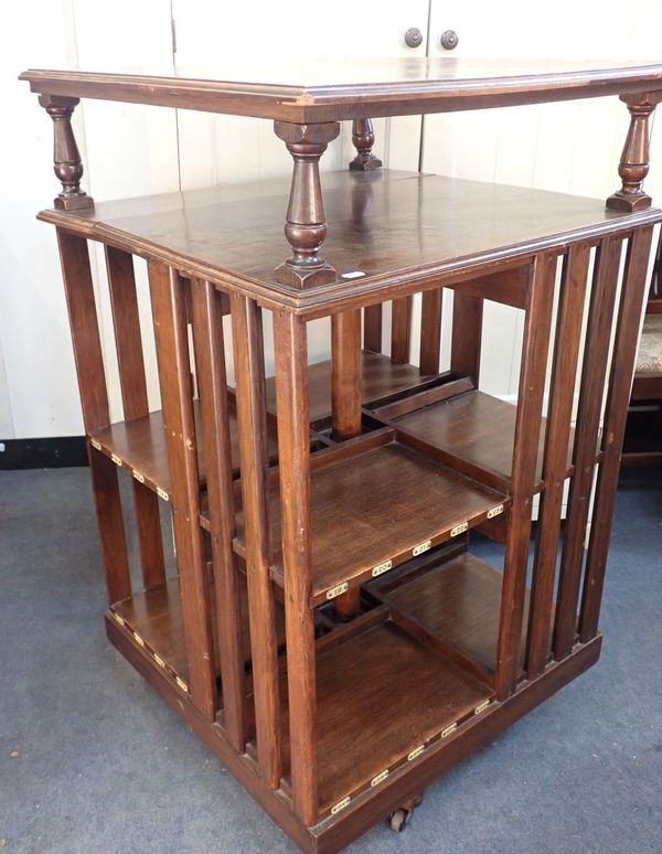 AN EDWARDIAN OAK REVOLVING BOOKCASE