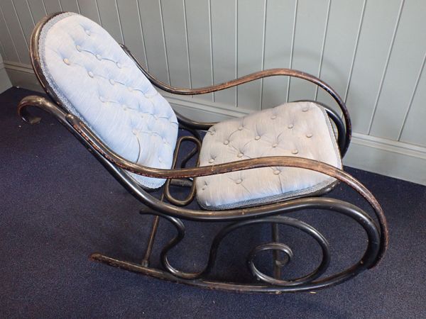 A THONET  ROCKING CHAIR, EBONISED