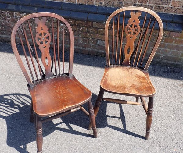 A PAIR OF WINDSOR WHEELBACK CHAIRS