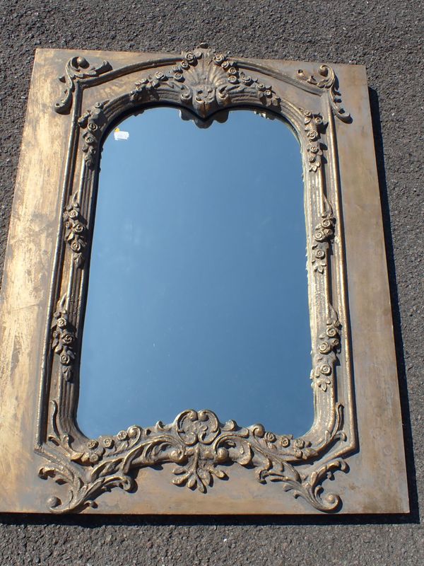 A ROCOCO STYLE WALL MIRROR WITH  MOULDED AND GILT FRAME